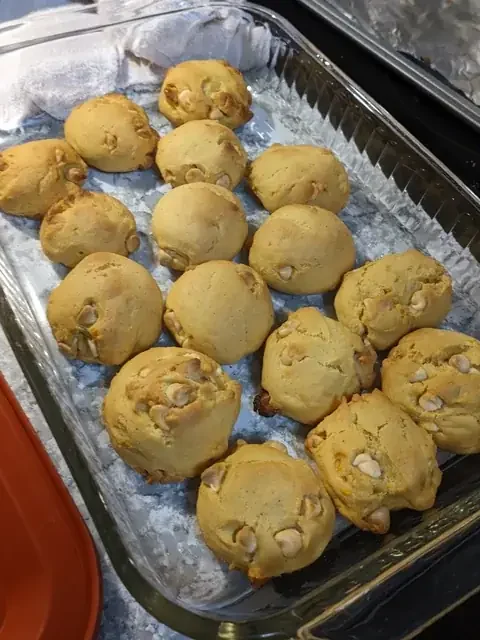 Easy pumpkin biscotti recipe: soft pumpkin cookies with white chocolate chips on a glass baking dish
